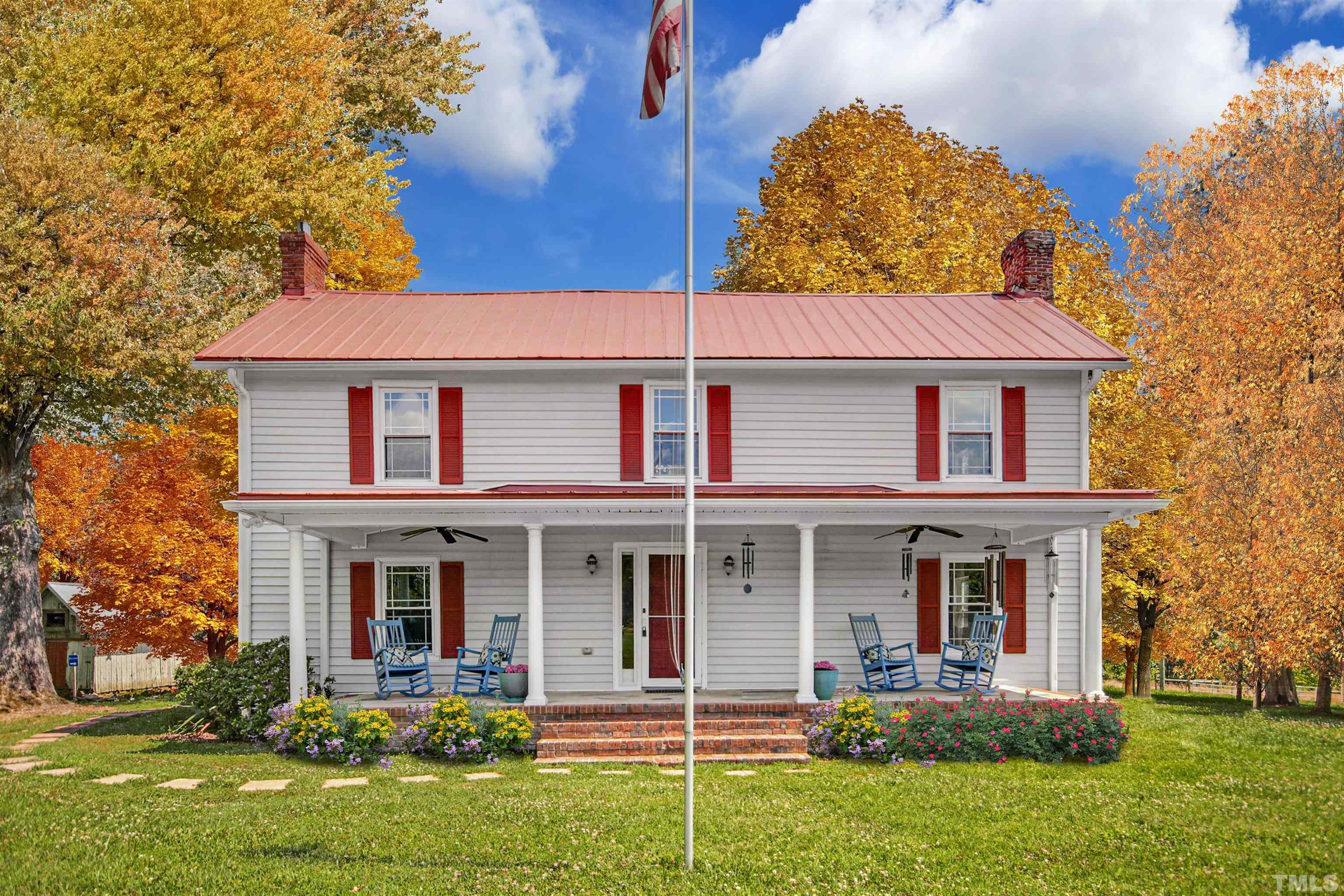 front view of a brick house with a yard
