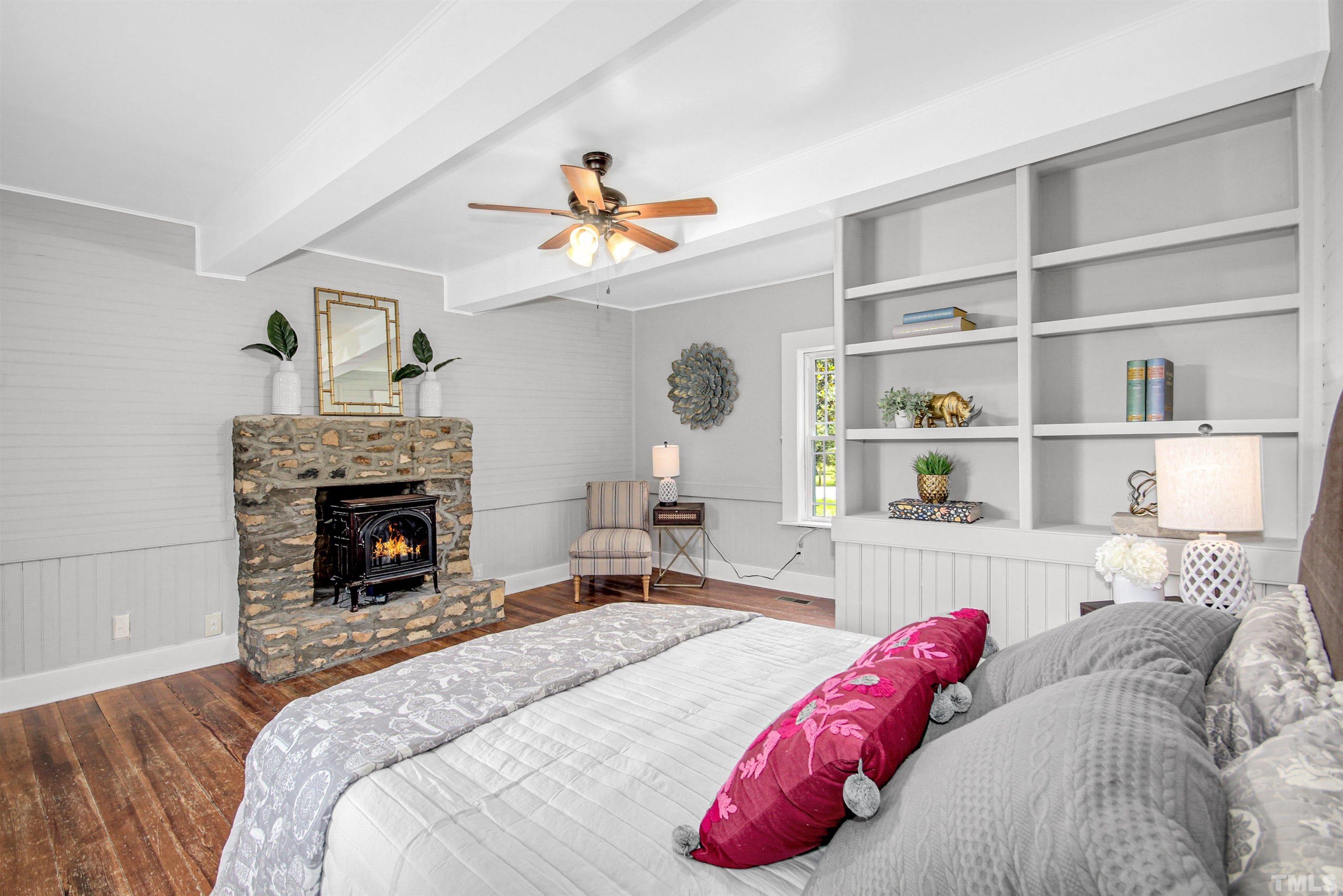 4610 Hall Road Rougemont, NC 27572 - Photo 11 of 43 a bedroom with a bed and a fireplace