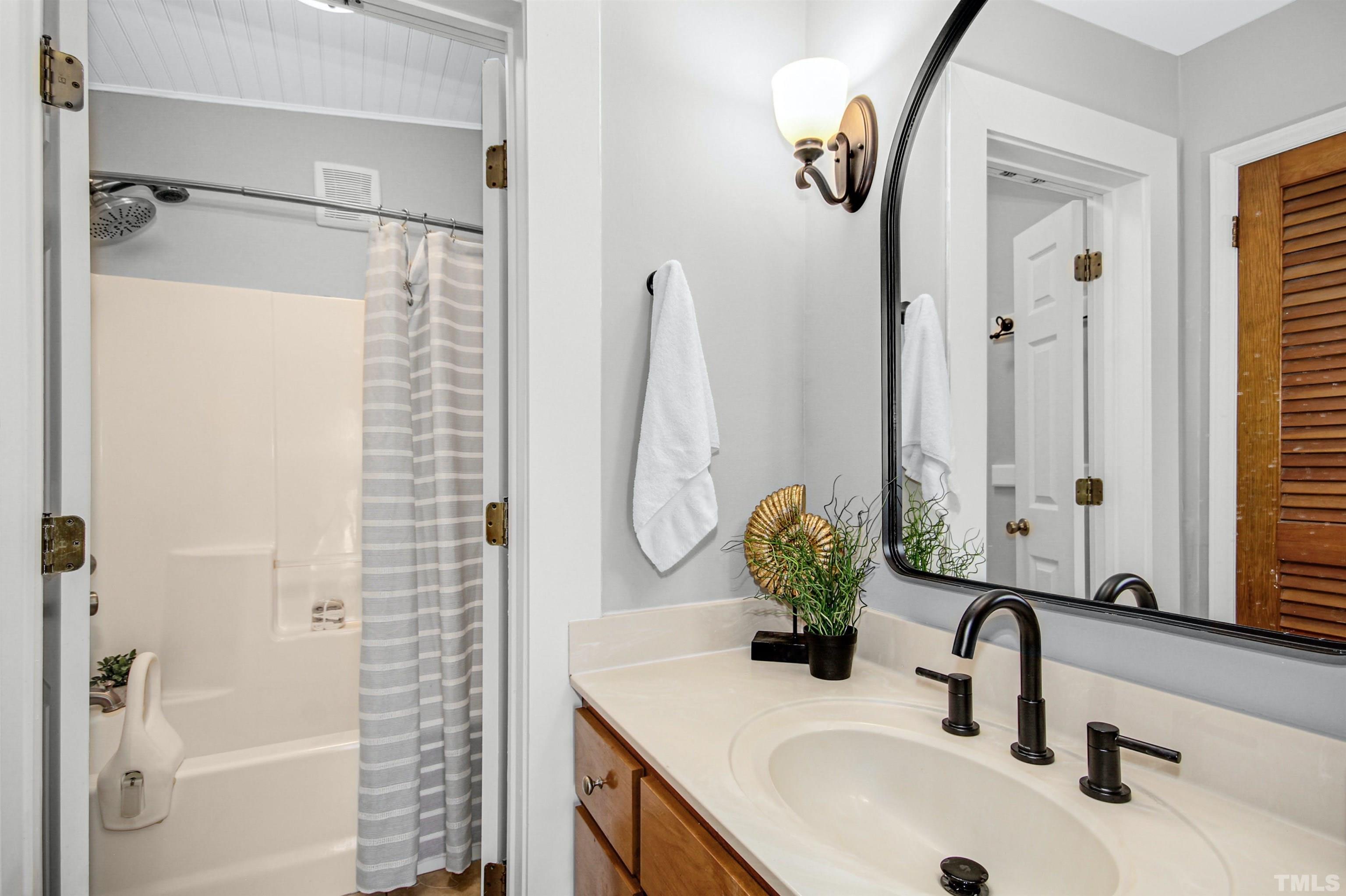 4610 Hall Road Rougemont, NC 27572 - Photo 13 of 43 a bathroom with a sink and a mirror
