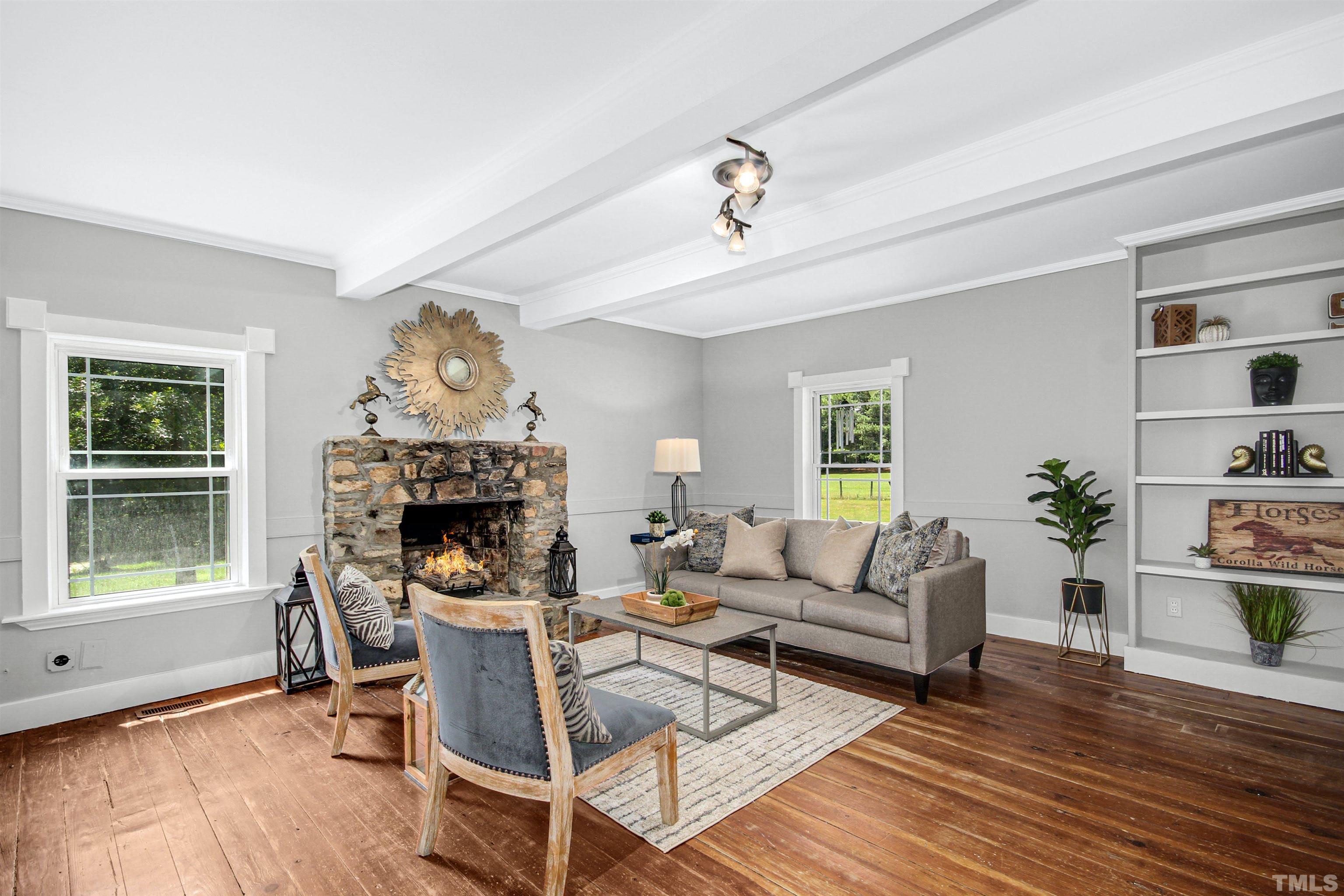 4610 Hall Road Rougemont, NC 27572 - Photo 16 of 43 a living room with furniture and a fireplace