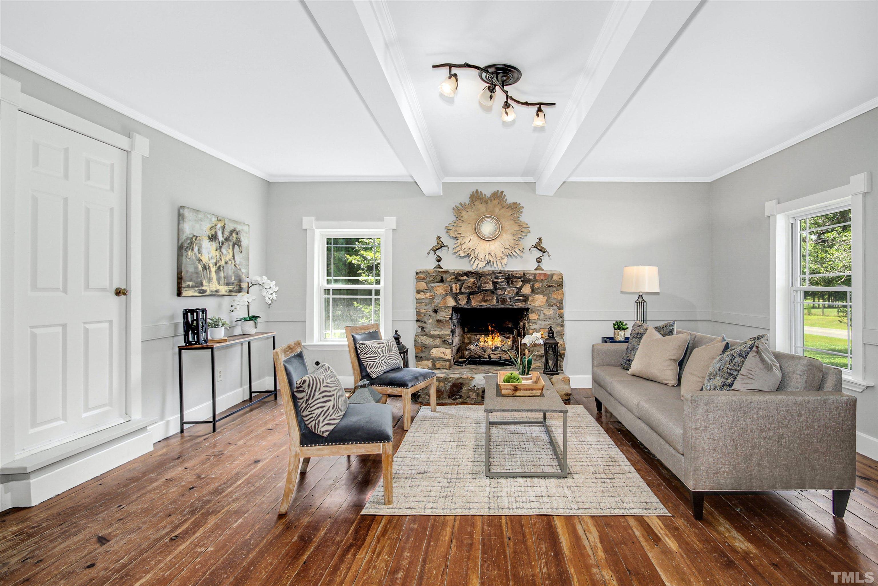 4610 Hall Road Rougemont, NC 27572 - Photo 18 of 43 a living room with furniture and a fireplace