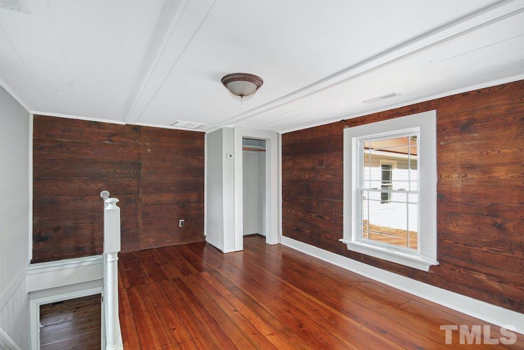 4610 Hall Road Rougemont, NC 27572 - Photo 21 of 43 a view of an empty room with wooden floor and a window
