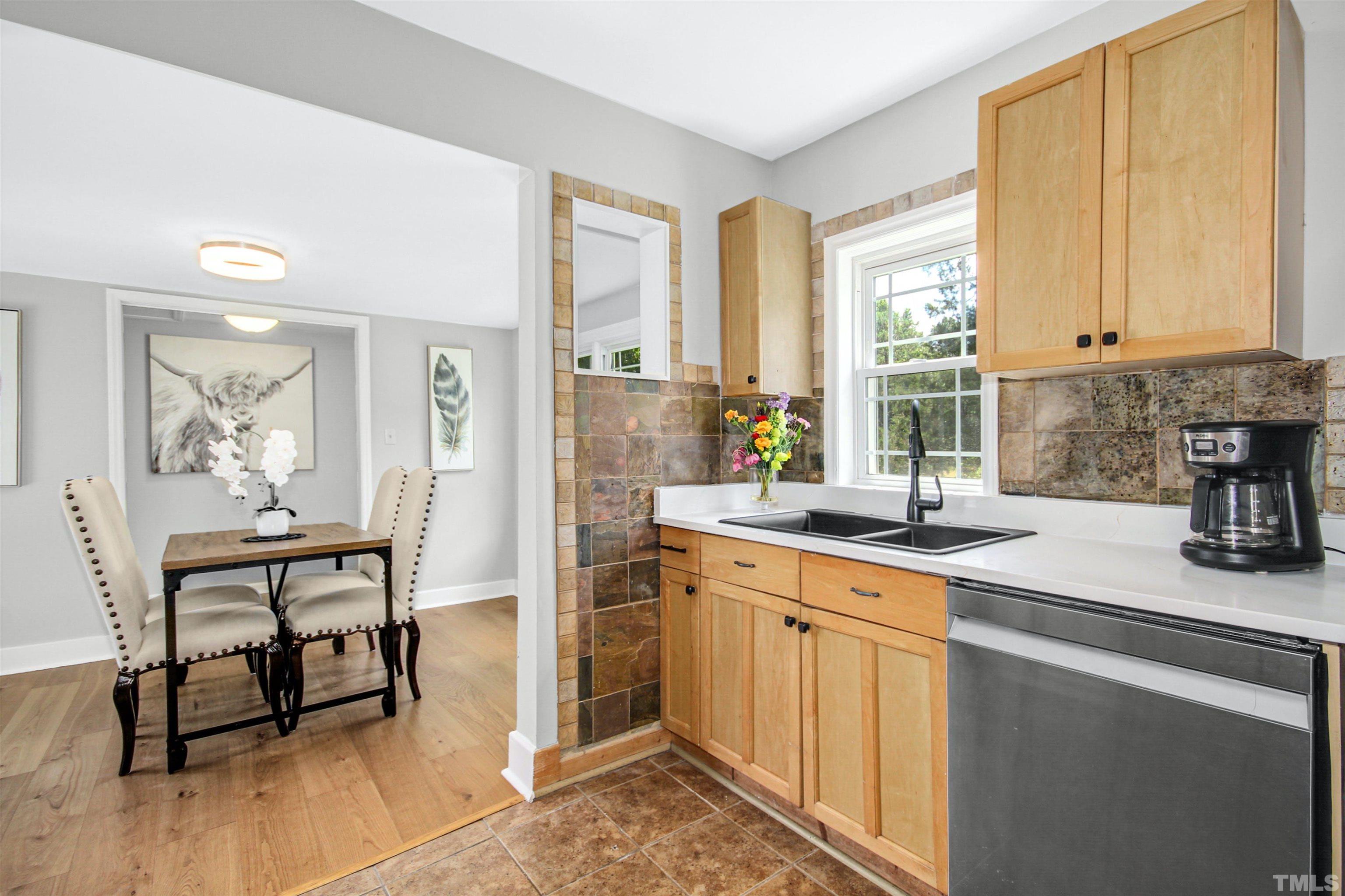 4610 Hall Road Rougemont, NC 27572 - Photo 27 of 43 a kitchen with a sink cabinets and window