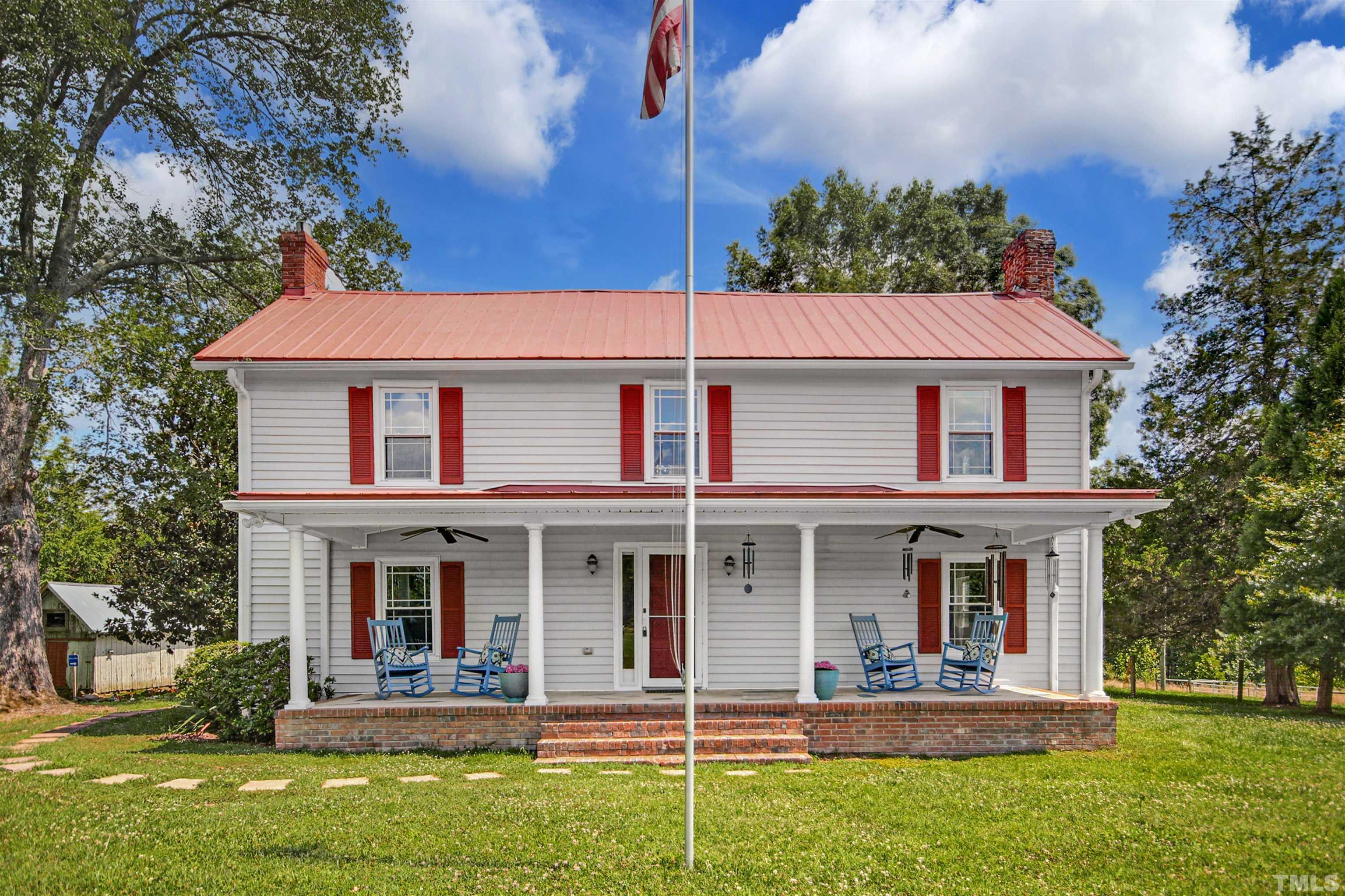 4610 Hall Road Rougemont, NC 27572 - Photo 4 of 43 a front view of a house with a yard