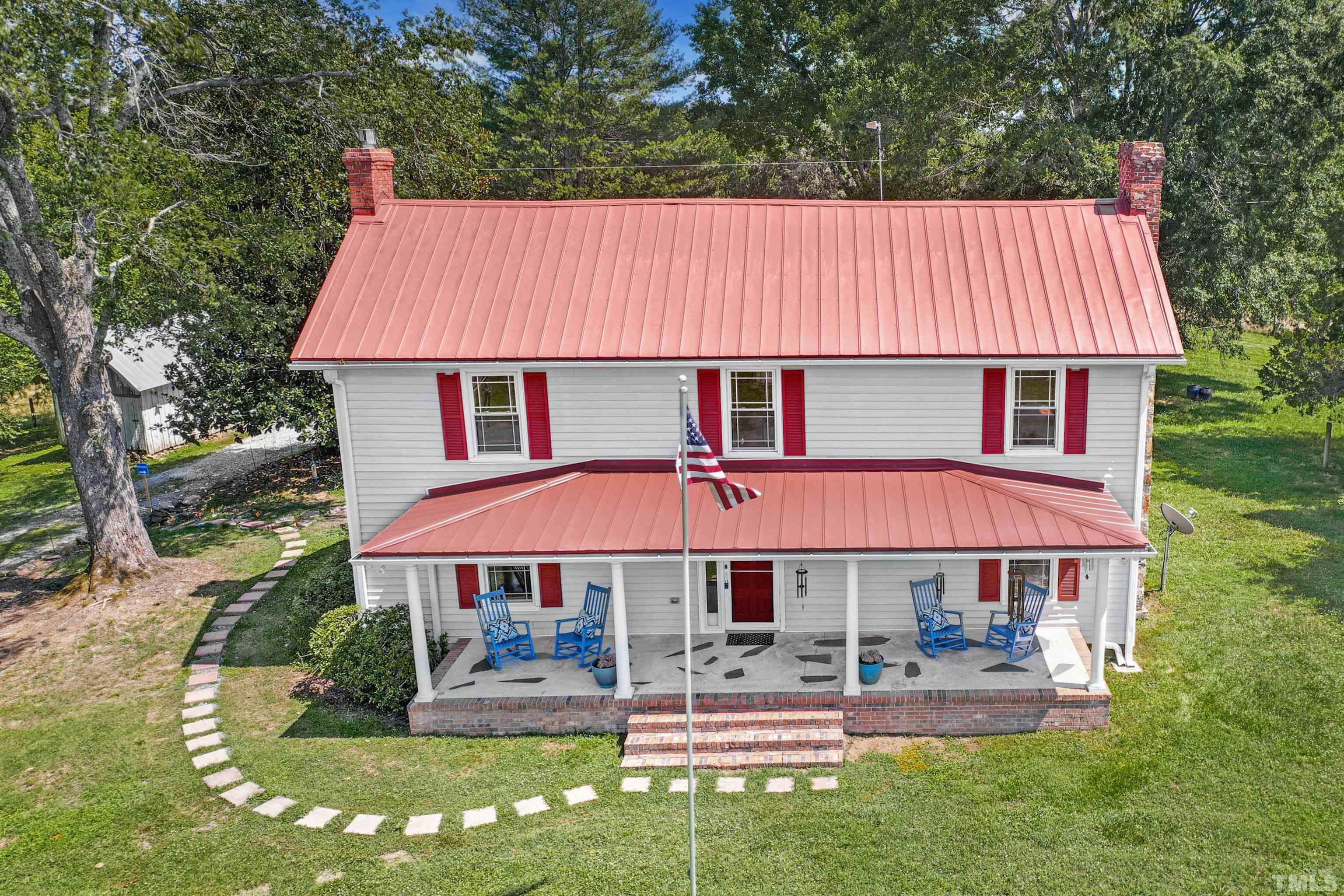 4610 Hall Road Rougemont, NC 27572 - Photo 5 of 43 a front view of a house with garden
