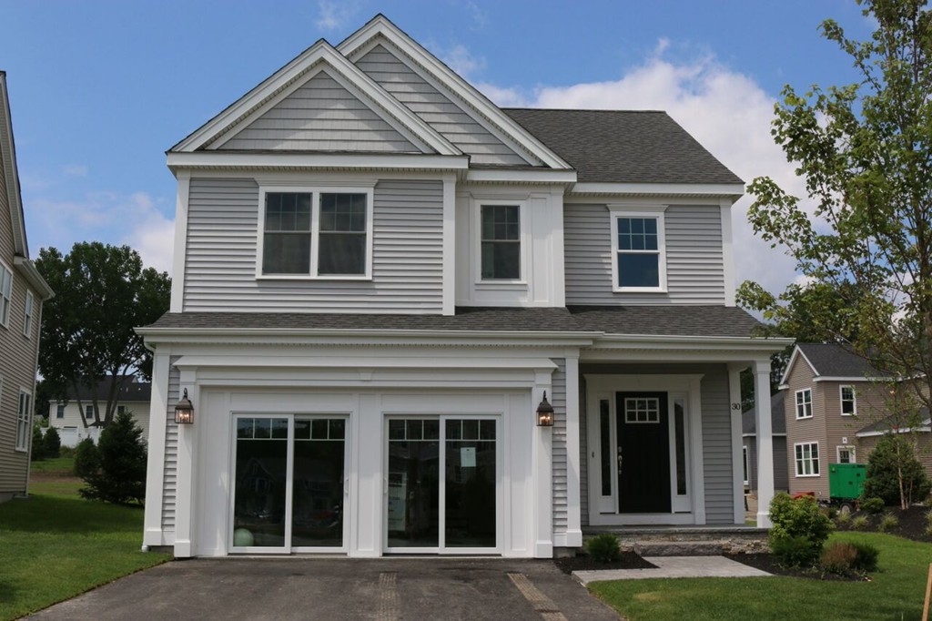 111 Oxbow Road Wayland, MA 01778 - Photo 1 of 4 a front view of a house with garden