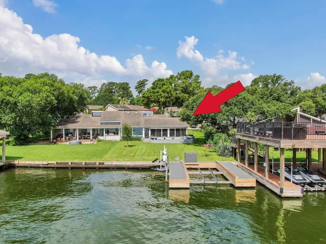 a view of house with swimming pool and yard