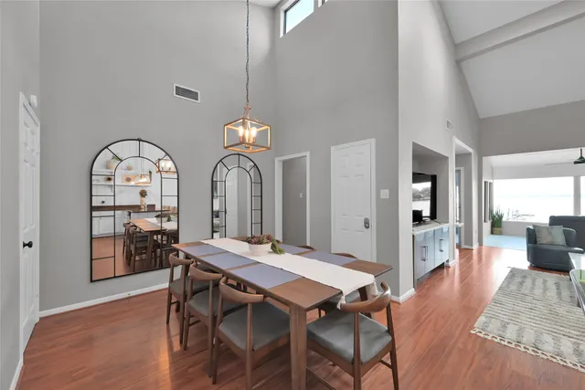 a view of a dining room with furniture window and wooden floor