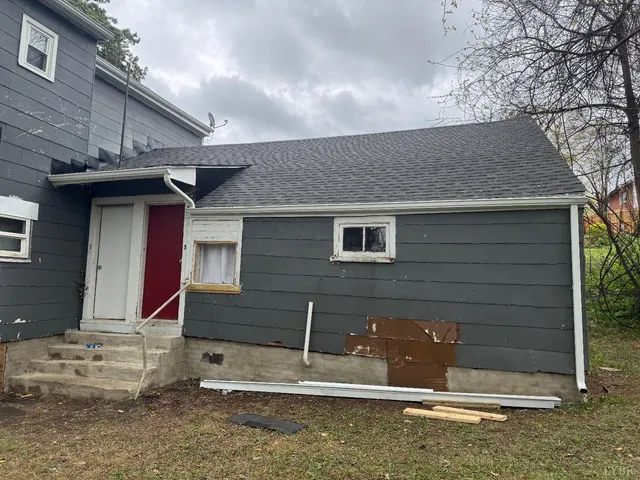 a front view of a house with stairs