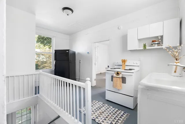 a kitchen with a sink a stove and refrigerator