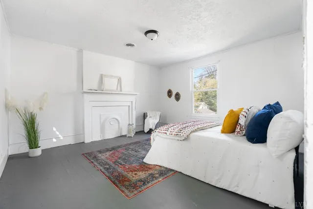 a bedroom with a bed and a couch