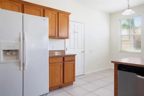 a kitchen with stainless steel appliances a sink stove and cabinets