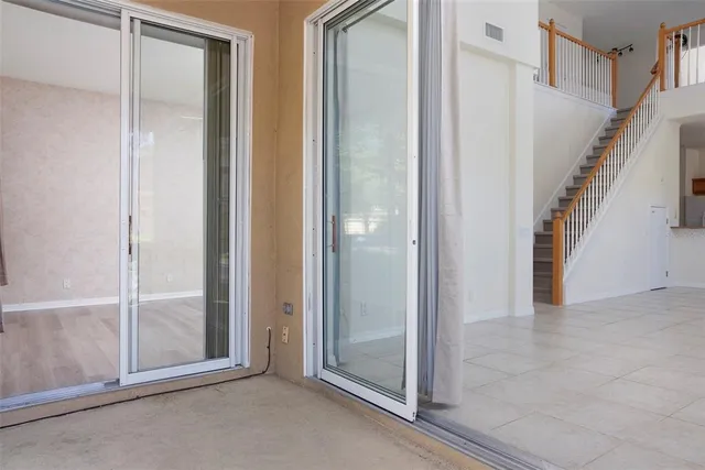 a bathroom with a tub a sink and a mirror
