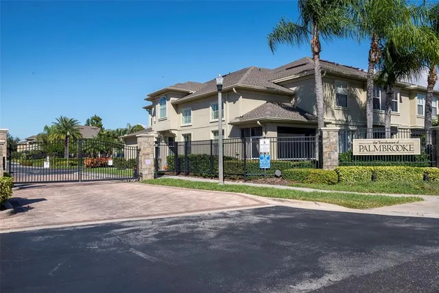 a front view of a house with swimming pool having outdoor seating