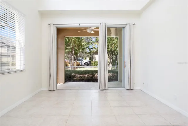 a view of a room with stairs and a large window