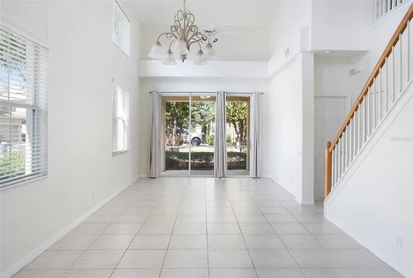 a view of a hallway with entryway a chandelier and entryway