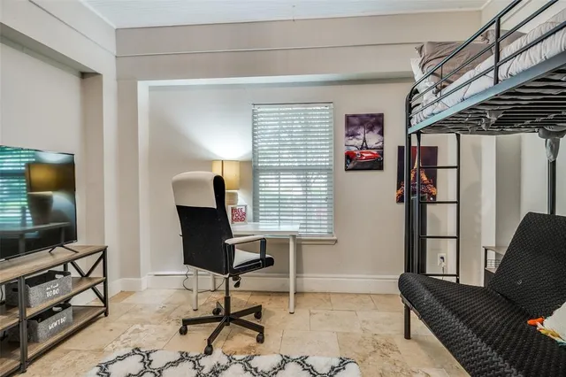 a view of a livingroom with furniture and a flat screen tv