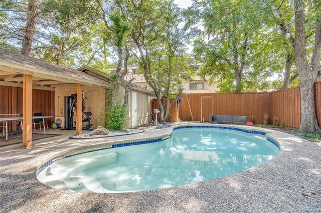 a view of a house with swimming pool