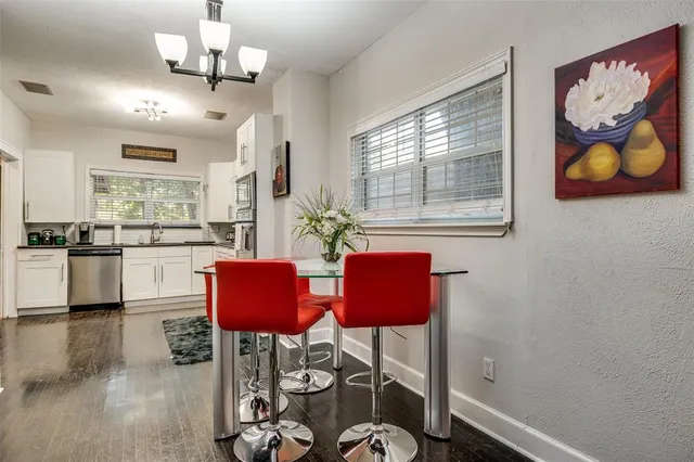 a view of kitchen with furniture and wooden floor