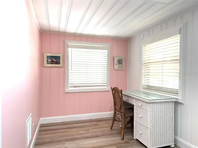 a workspace with furniture and a window