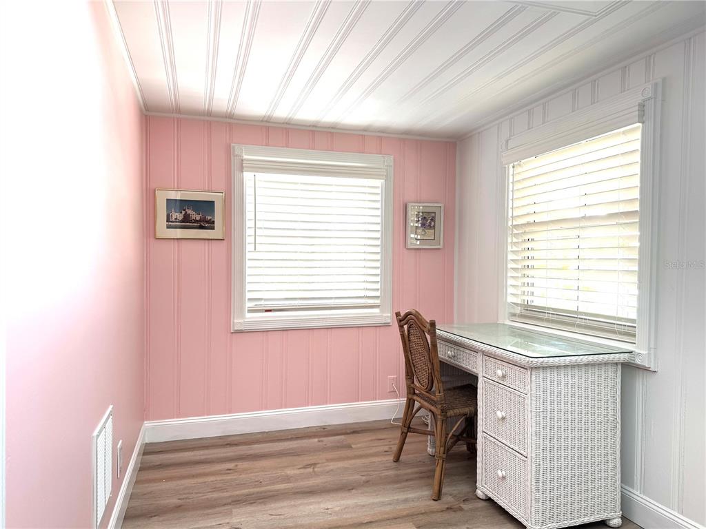701 Broadway Street Longboat Key, FL 34228 - Photo 21 of 33 a workspace with furniture and a window