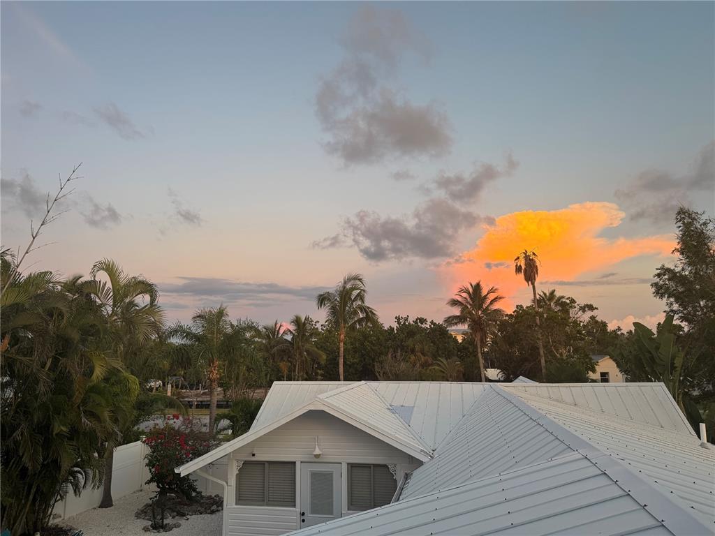 701 Broadway Street Longboat Key, FL 34228 - Photo 24 of 33 a view of a house with a big yard