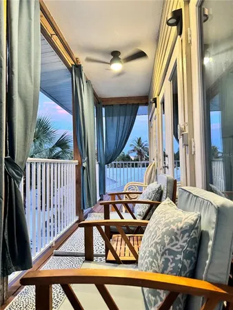 a view of balcony with furniture