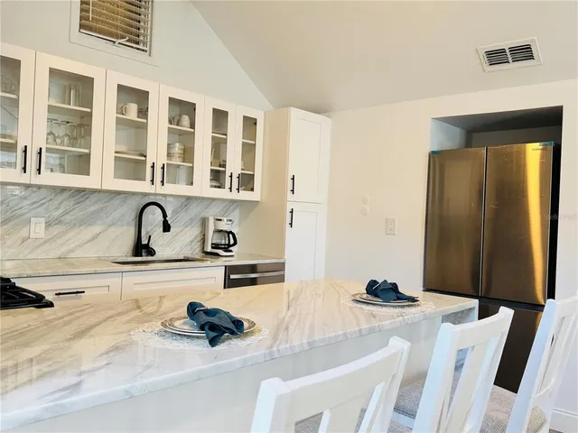 a kitchen with a sink and cabinets