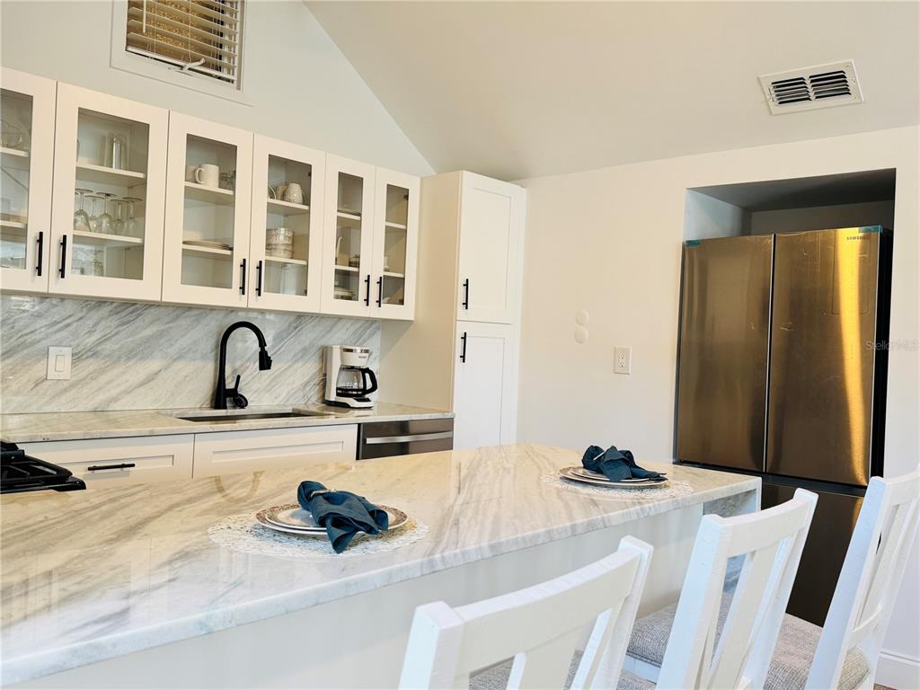 701 Broadway Street Longboat Key, FL 34228 - Photo 7 of 33 a kitchen with a sink and cabinets