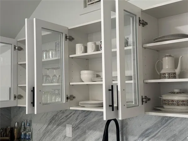 a room with a walk in closet and a wooden floor