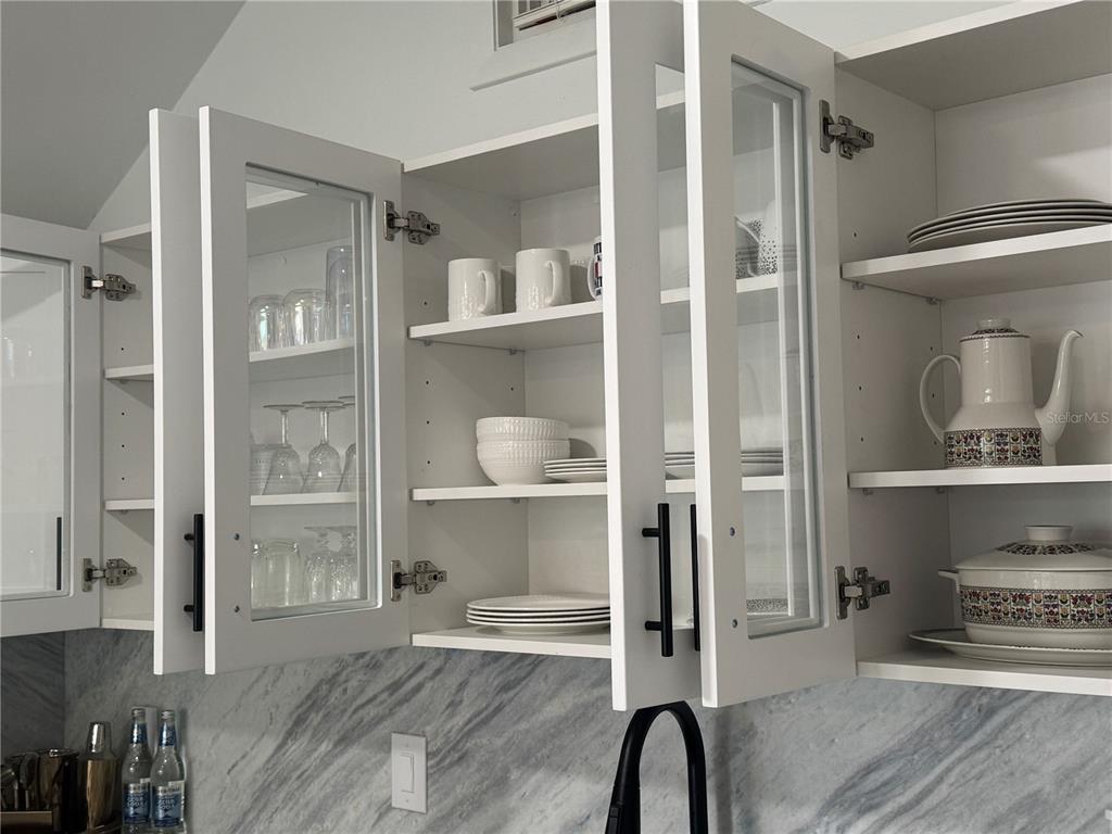 701 Broadway Street Longboat Key, FL 34228 - Photo 8 of 33 a room with a walk in closet and a wooden floor