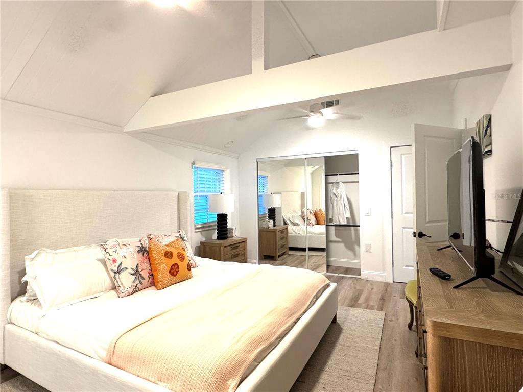 701 Broadway Street Longboat Key, FL 34228 - Photo 10 of 33 a bed room with a bed window and a chair