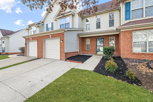 front view of a house with a yard