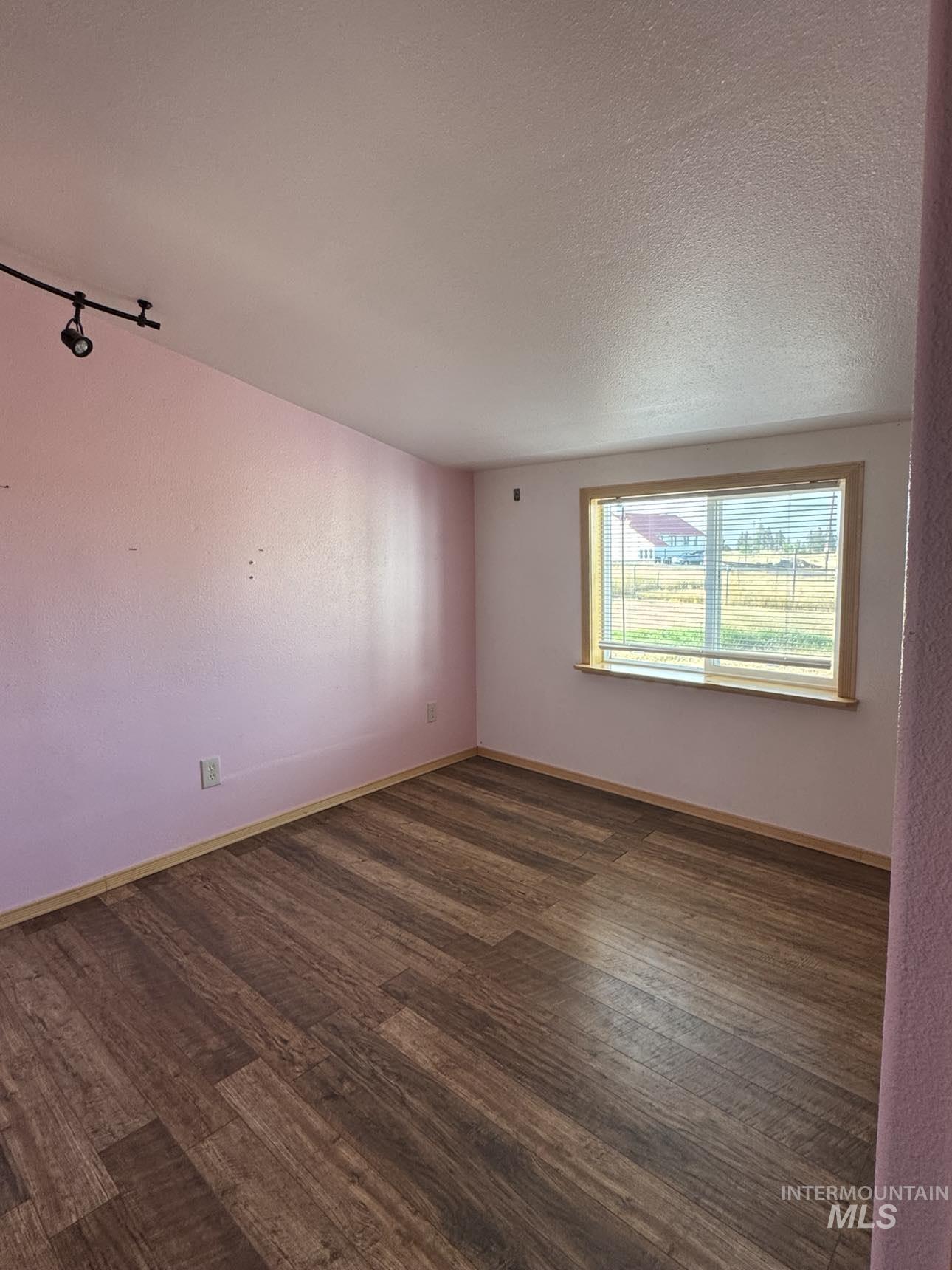 40336 Sr 129 Anatone, WA 99401 - Photo 11 of 29 Bedroom featuring wood finished floors and a textured ceiling