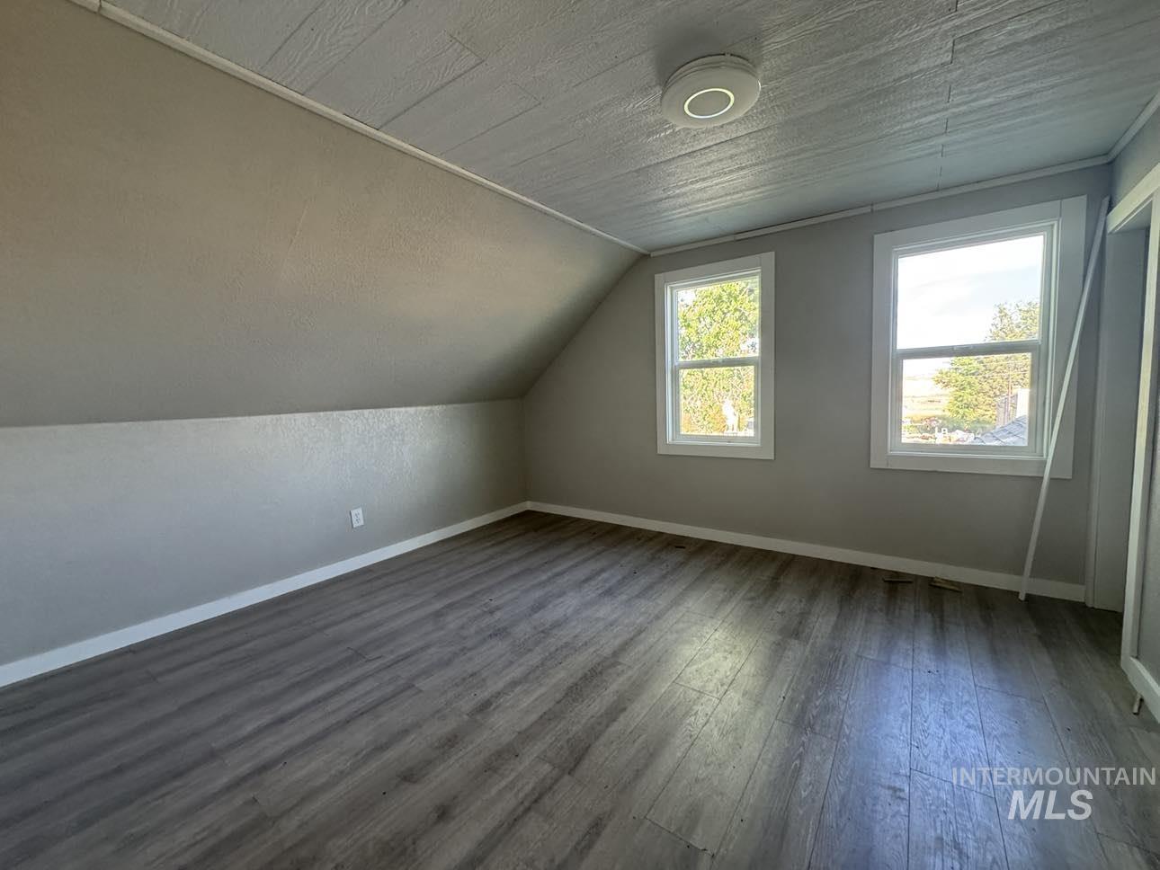 40336 Sr 129 Anatone, WA 99401 - Photo 27 of 29 Bonus room with dark wood-style floors and vaulted ceiling