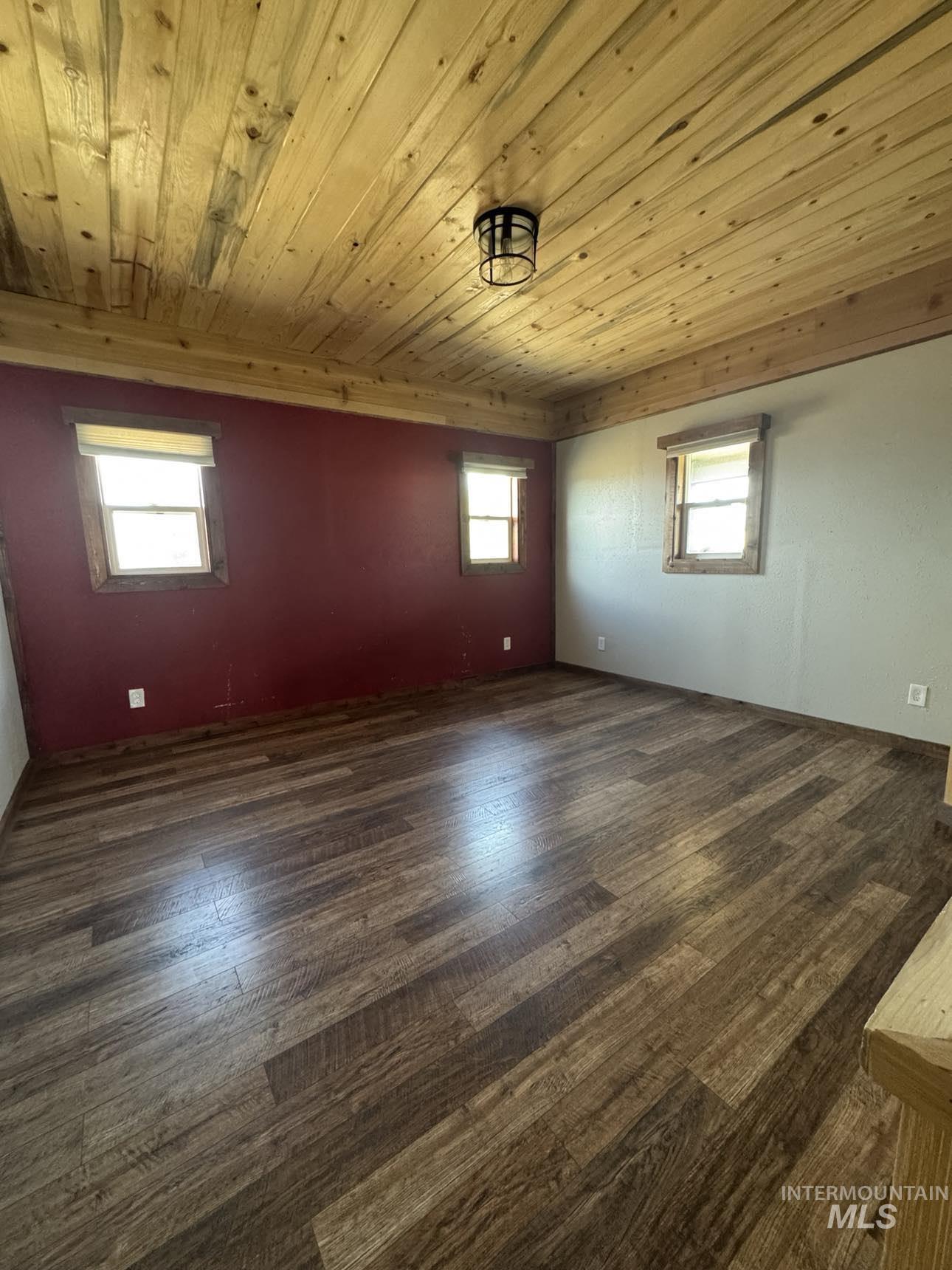 40336 Sr 129 Anatone, WA 99401 - Photo 8 of 29 Unfurnished room featuring wood ceiling, dark wood-style flooring, and healthy amount of natural light