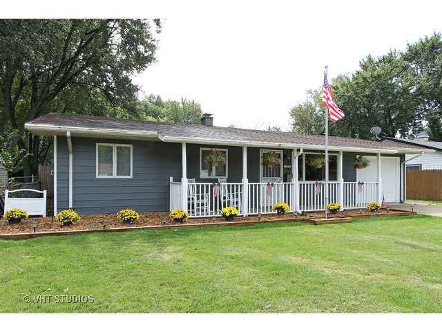 115 East Oltendorf Road Streamwood, IL 60107 - Photo 1 of 10 a front view of house with yard and green space