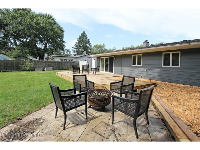 115 East Oltendorf Road Streamwood, IL 60107 - Photo 8 of 10 a backyard of a house with table and chairs