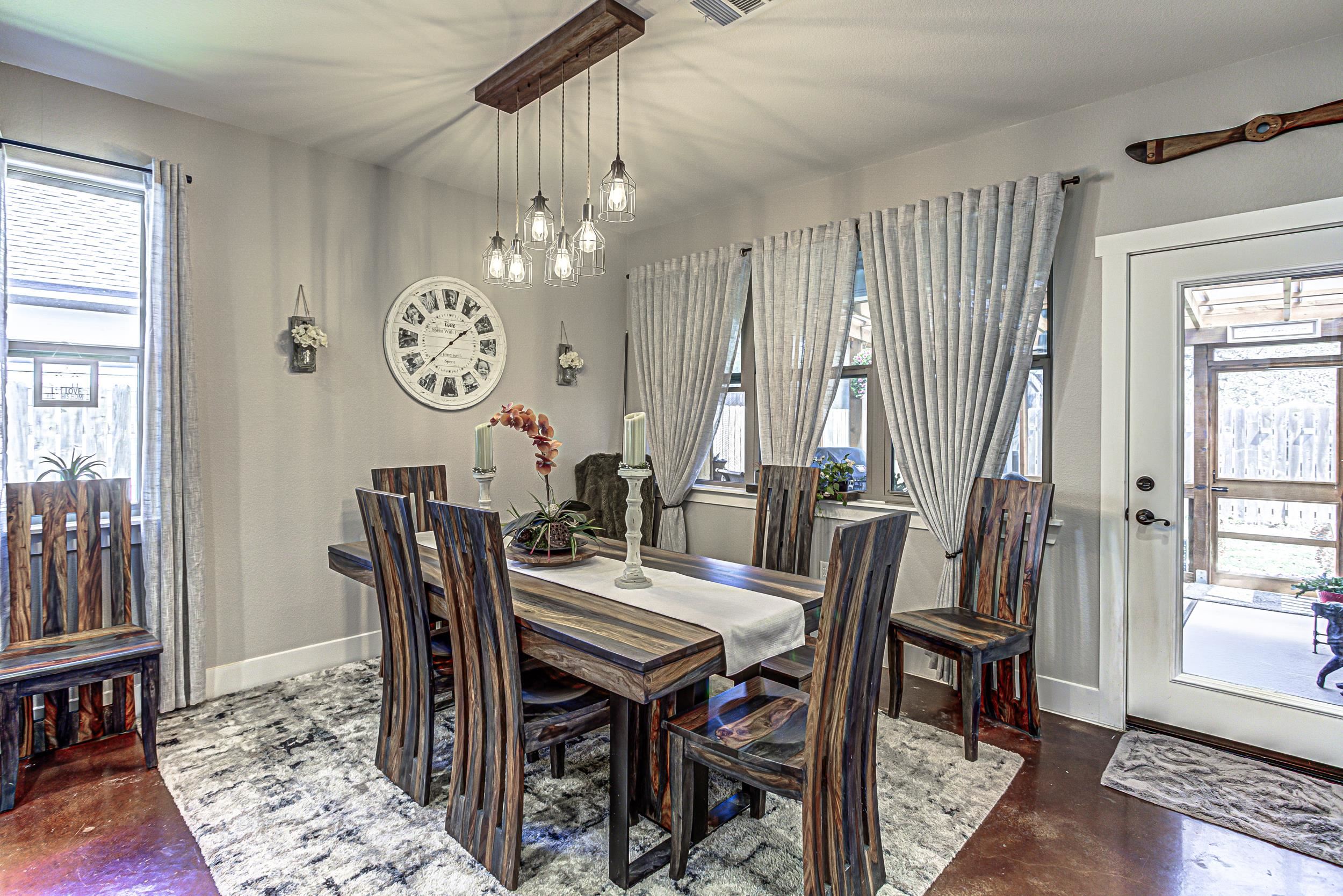 433 Dove Trail Bertram, TX 78605 - Photo 15 of 30 a view of a dining area with furniture and window