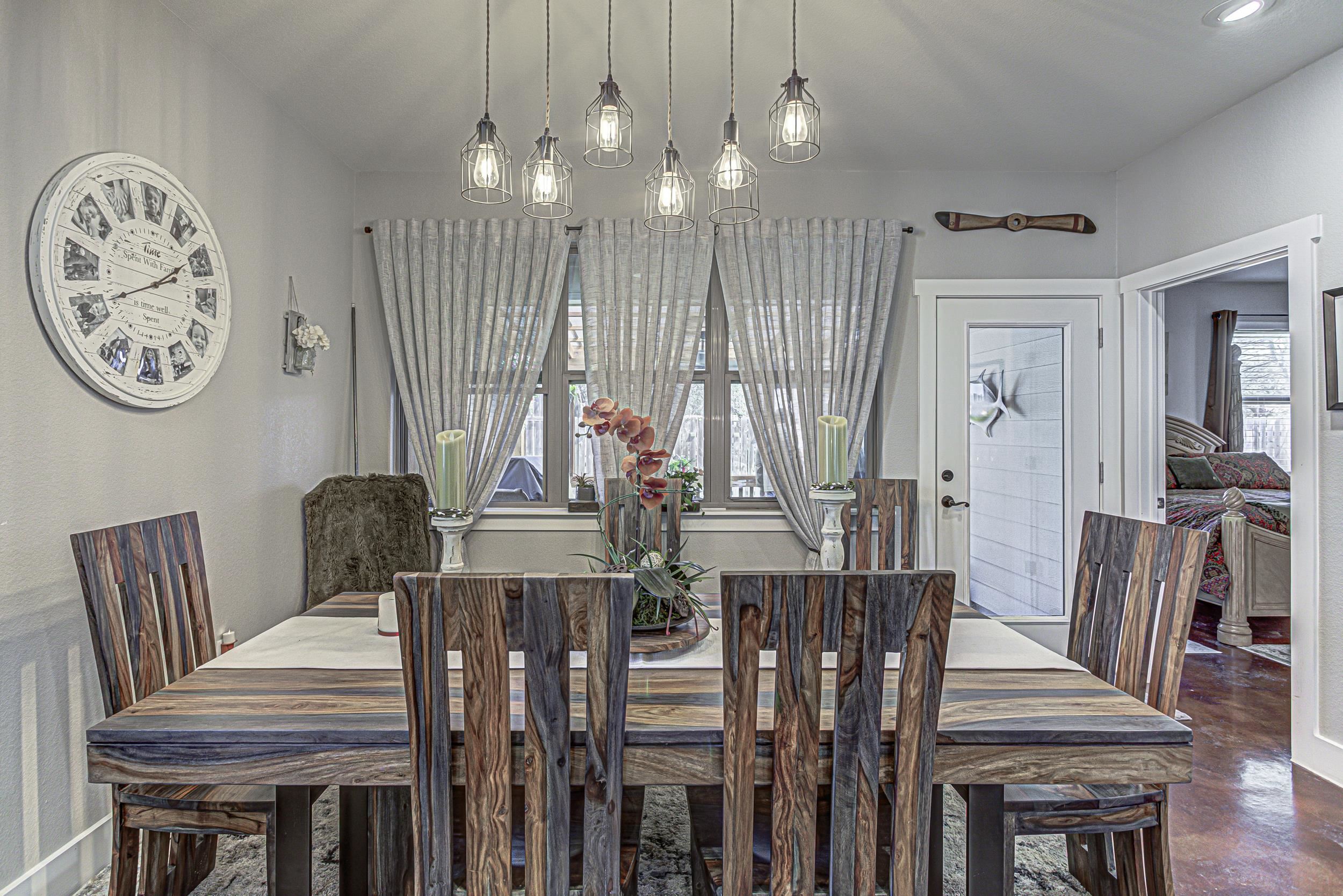 433 Dove Trail Bertram, TX 78605 - Photo 16 of 30 a view of a dining room with furniture and wooden floor
