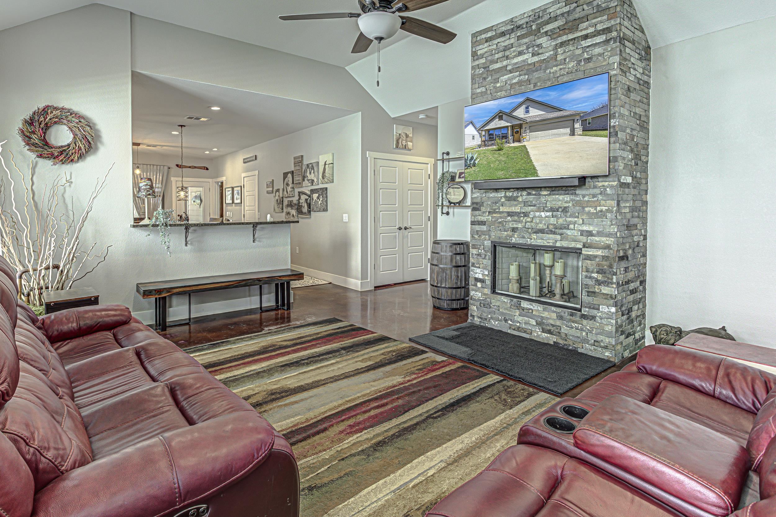 433 Dove Trail Bertram, TX 78605 - Photo 6 of 30 a living room with furniture and a fireplace