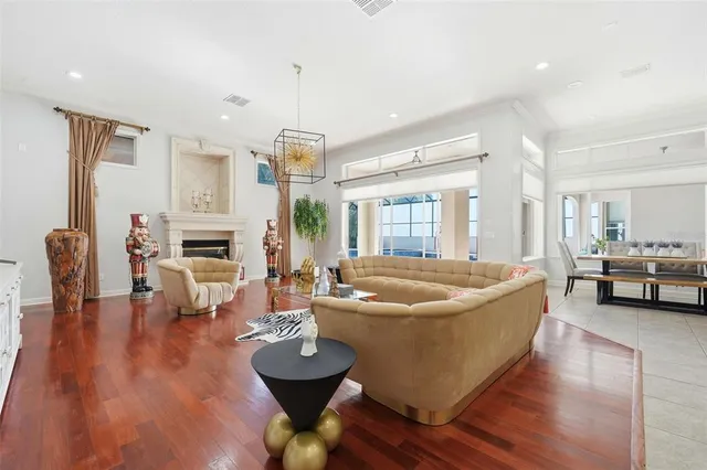 a kitchen with granite countertop white cabinets and stainless steel appliances