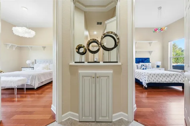 a bedroom with a bed and a table in it