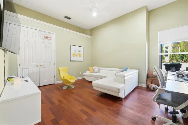a large white kitchen with a large window