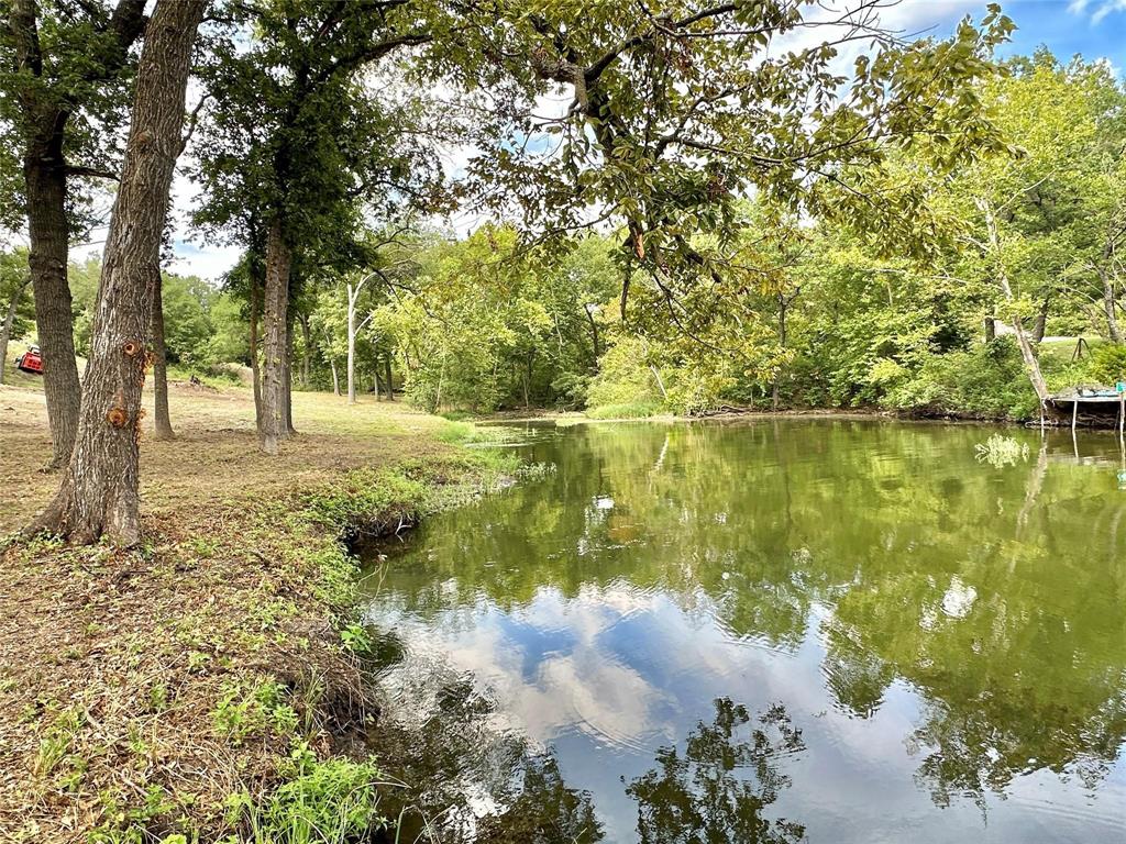 2.3-acres North Harrell Road Gainesville, TX 76240 - Photo 2 of 29 a view of a lake with a tree