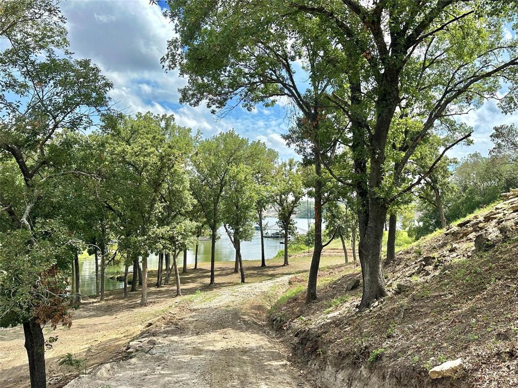 2.3-acres North Harrell Road Gainesville, TX 76240 - Photo 21 of 29 a view of road with trees