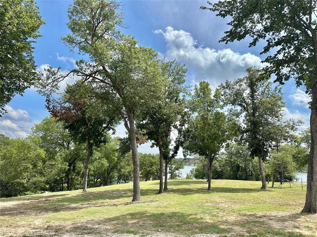 2.3-acres North Harrell Road Gainesville, TX 76240 - Photo 23 of 29 a view of a fountain with tree in the background