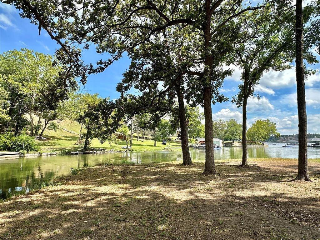 2.3-acres North Harrell Road Gainesville, TX 76240 - Photo 27 of 29 a view of a lake with a tree