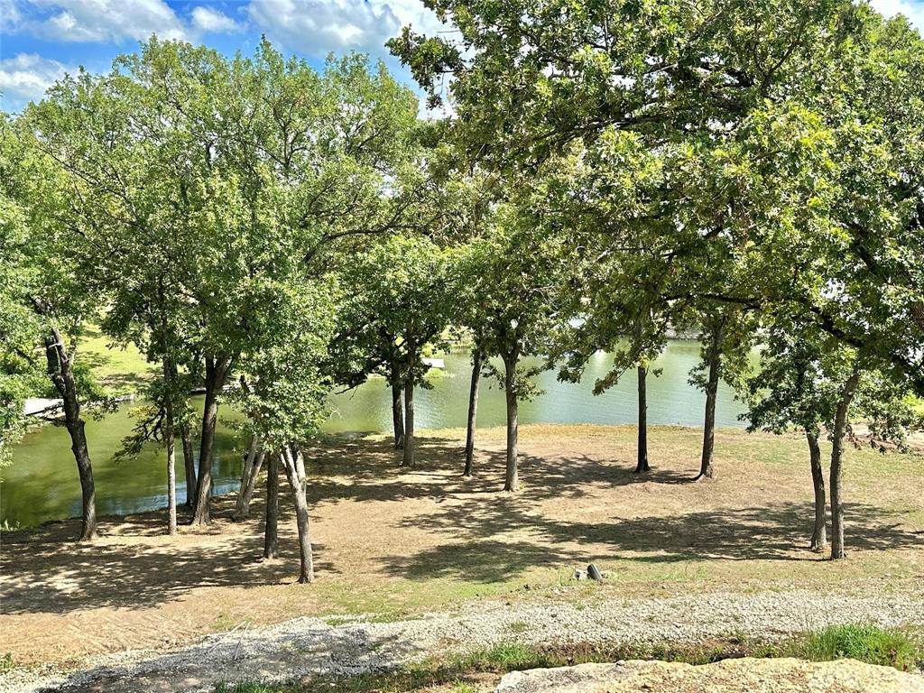 2.3-acres North Harrell Road Gainesville, TX 76240 - Photo 7 of 29 a view of a yard with trees