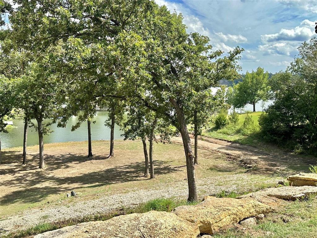 2.3-acres North Harrell Road Gainesville, TX 76240 - Photo 8 of 29 a view of a yard with trees